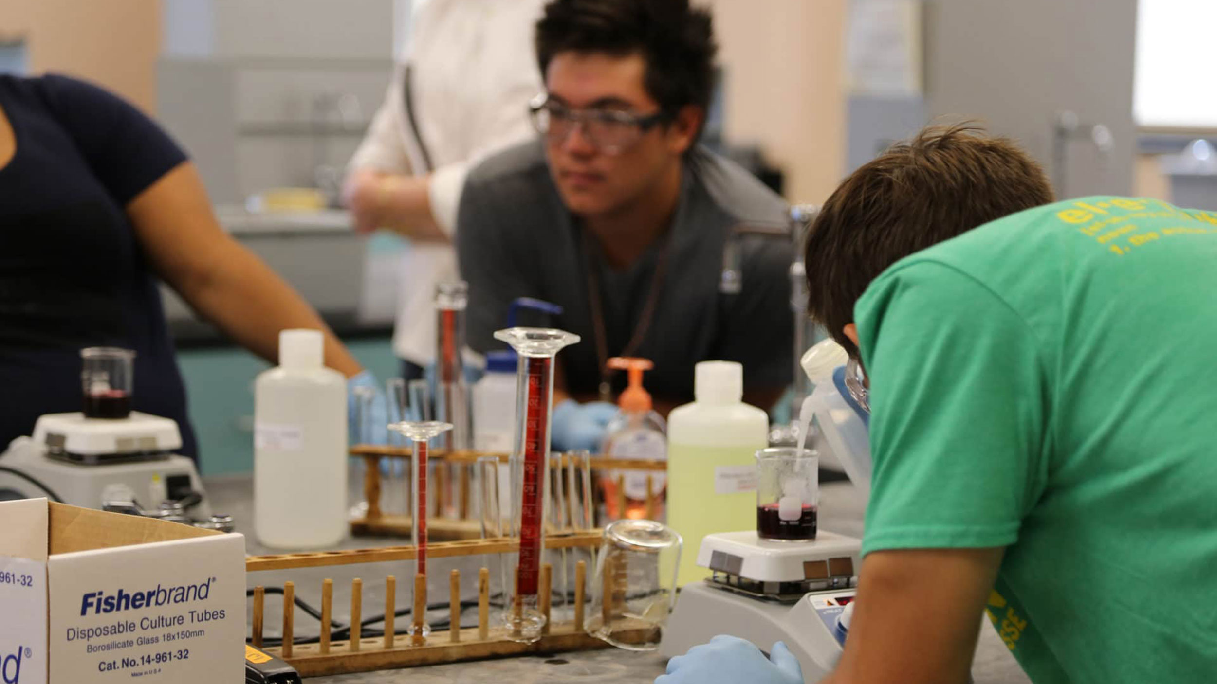 A group of people working in a lab.